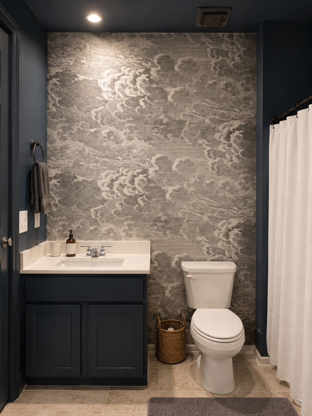 Grey cloud mural wallpaper in a navy bathroom in Atlanta, GA
