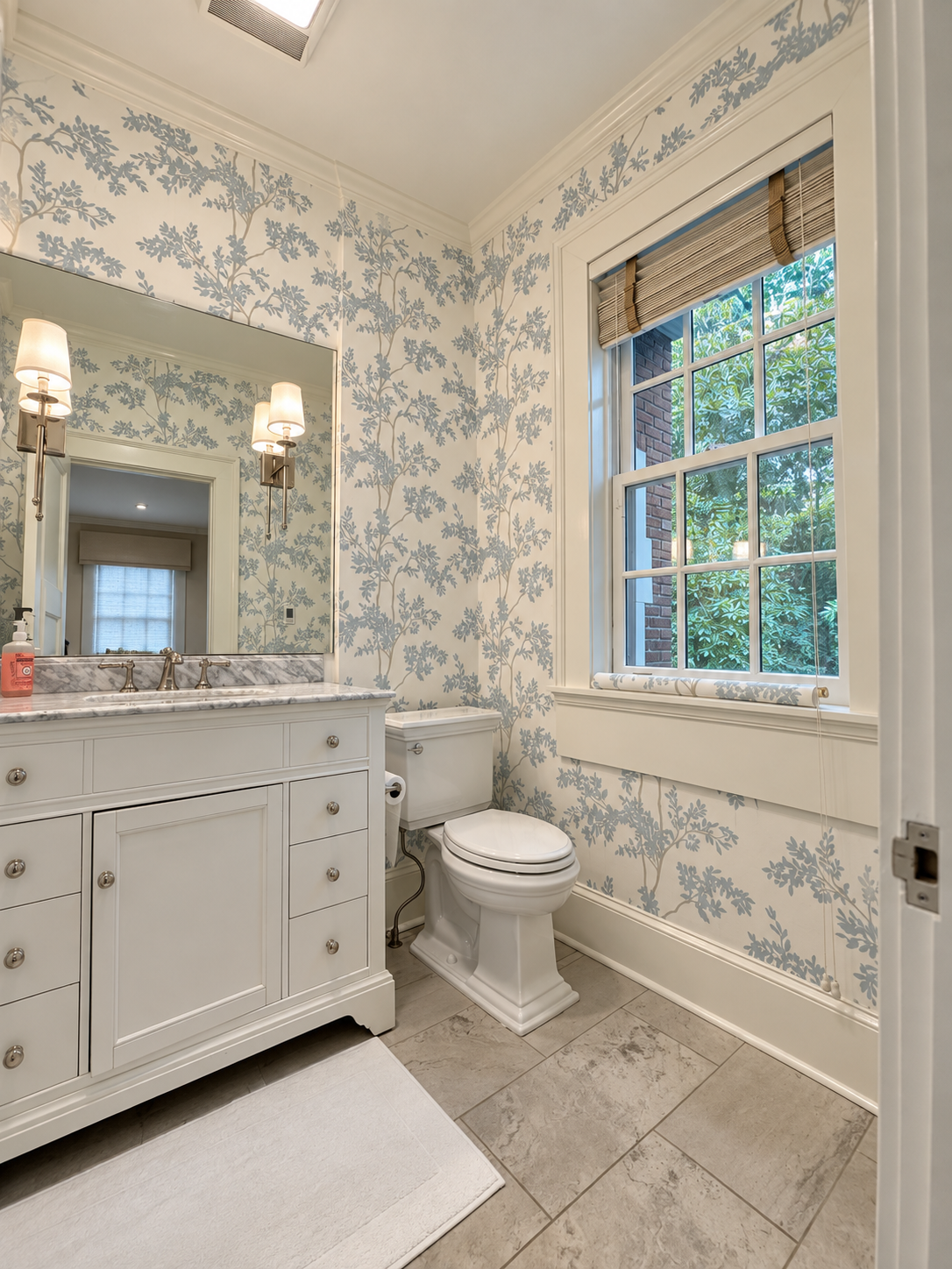 Bright white-and-blue floral wallpaper installation in a powder room in Atlanta, GA